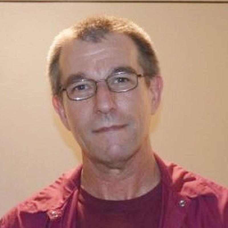 man in maroon shirt